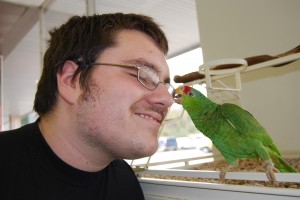 Randy with Rocky, the parrot he's working towards buying.
